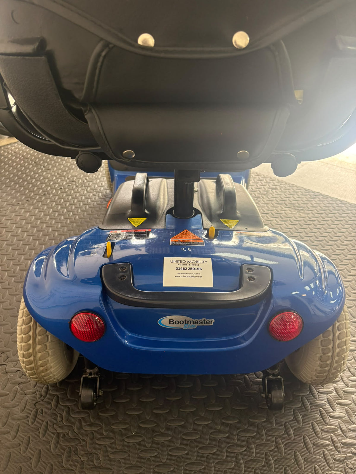 Eden Bootmaster scooter rear with blue body, red lights and raised seat