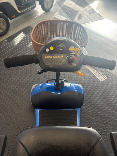 Eden Bootmaster scooter controls, handlebars, key and brown front basket