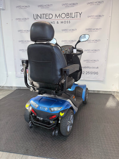 Blue mobility scooter rear three-quarter view with black seat and headrest