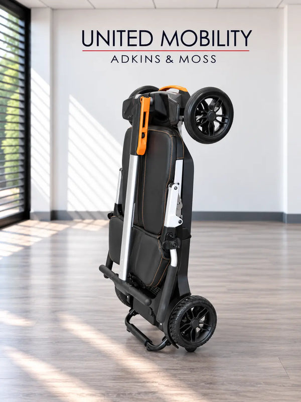 Folding mobility scooter upright with dark seat, orange handle, and four wheels