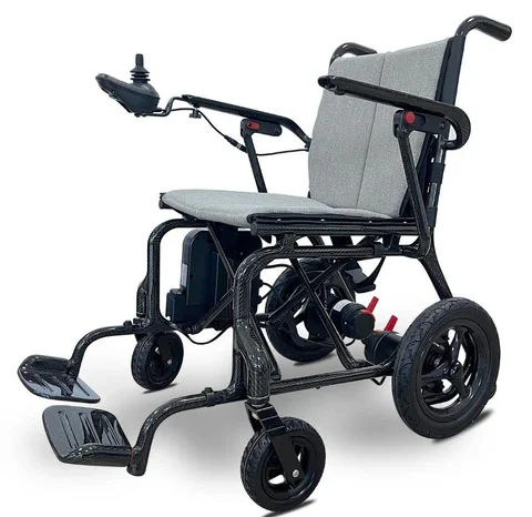 Electric wheelchair with a grey seat and black frame, featuring joystick controls and footrests.